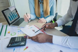bookkeeper with client discussing financial reports