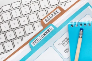 blue folder with word personnel and brown folder with word salary